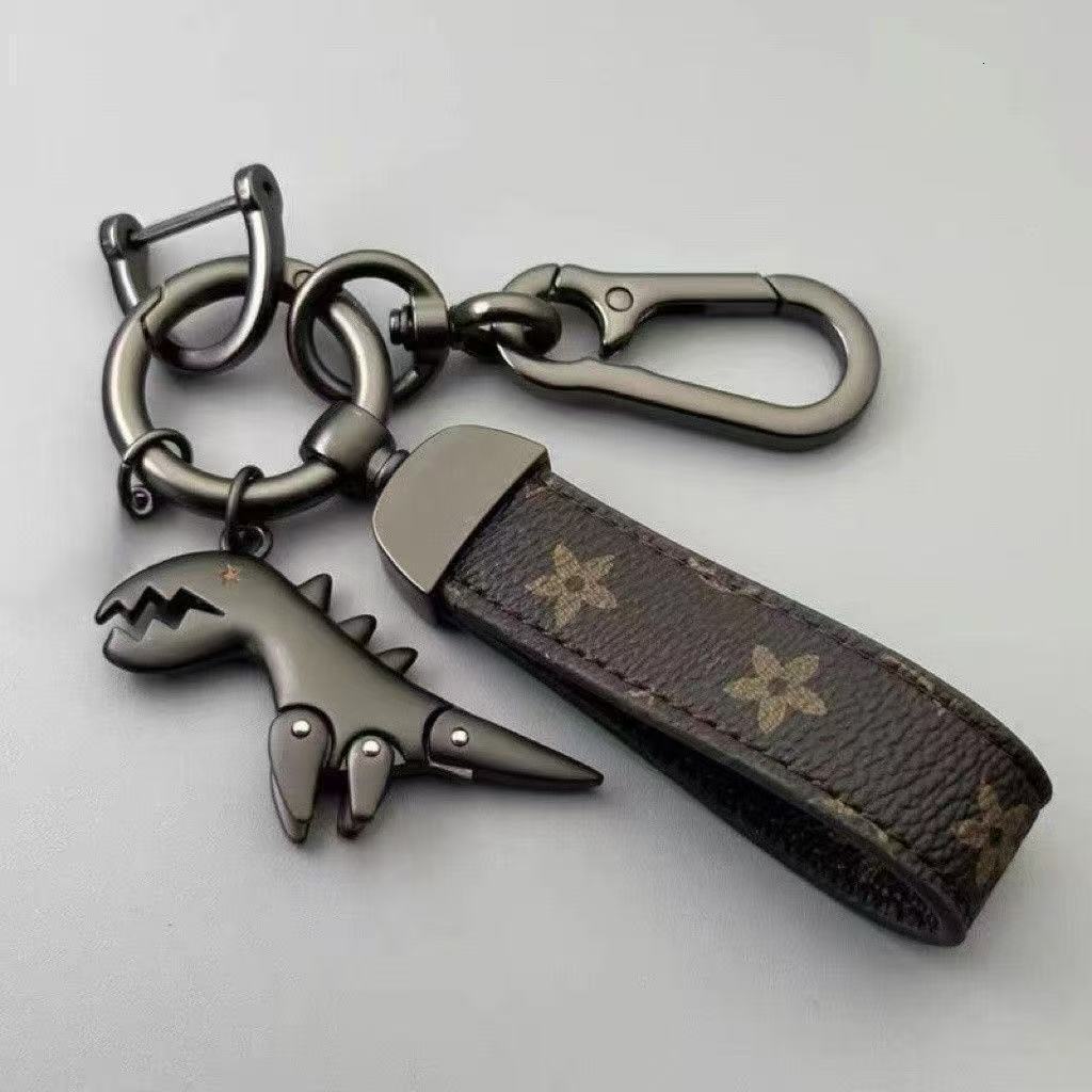 Cartoon cute little dinosaur keychain metal pendant for men, car couple style, high-end leather strap keychain for waist hanging
