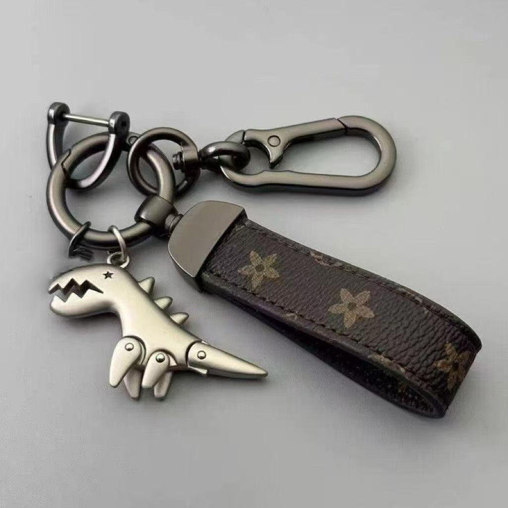 Cartoon cute little dinosaur keychain metal pendant for men, car couple style, high-end leather strap keychain for waist hanging