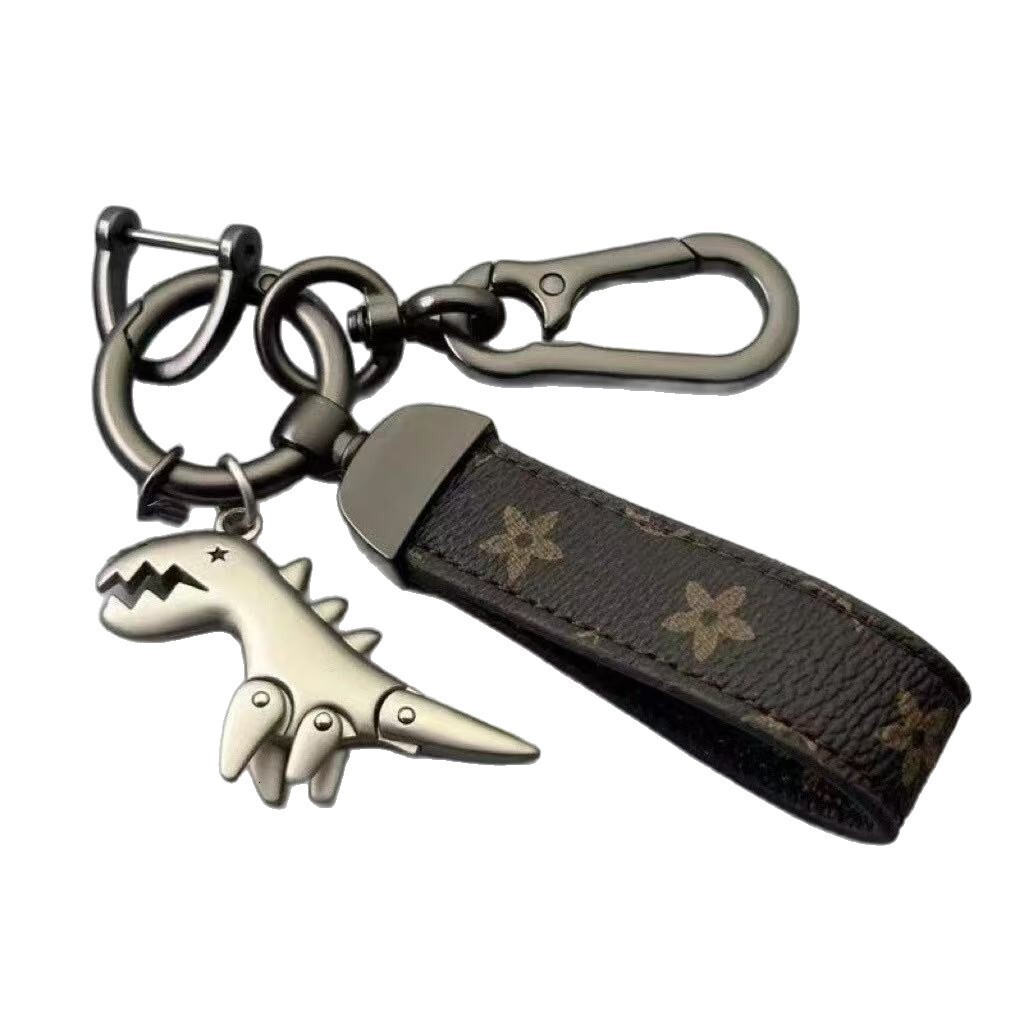 Cartoon cute little dinosaur keychain metal pendant for men, car couple style, high-end leather strap keychain for waist hanging