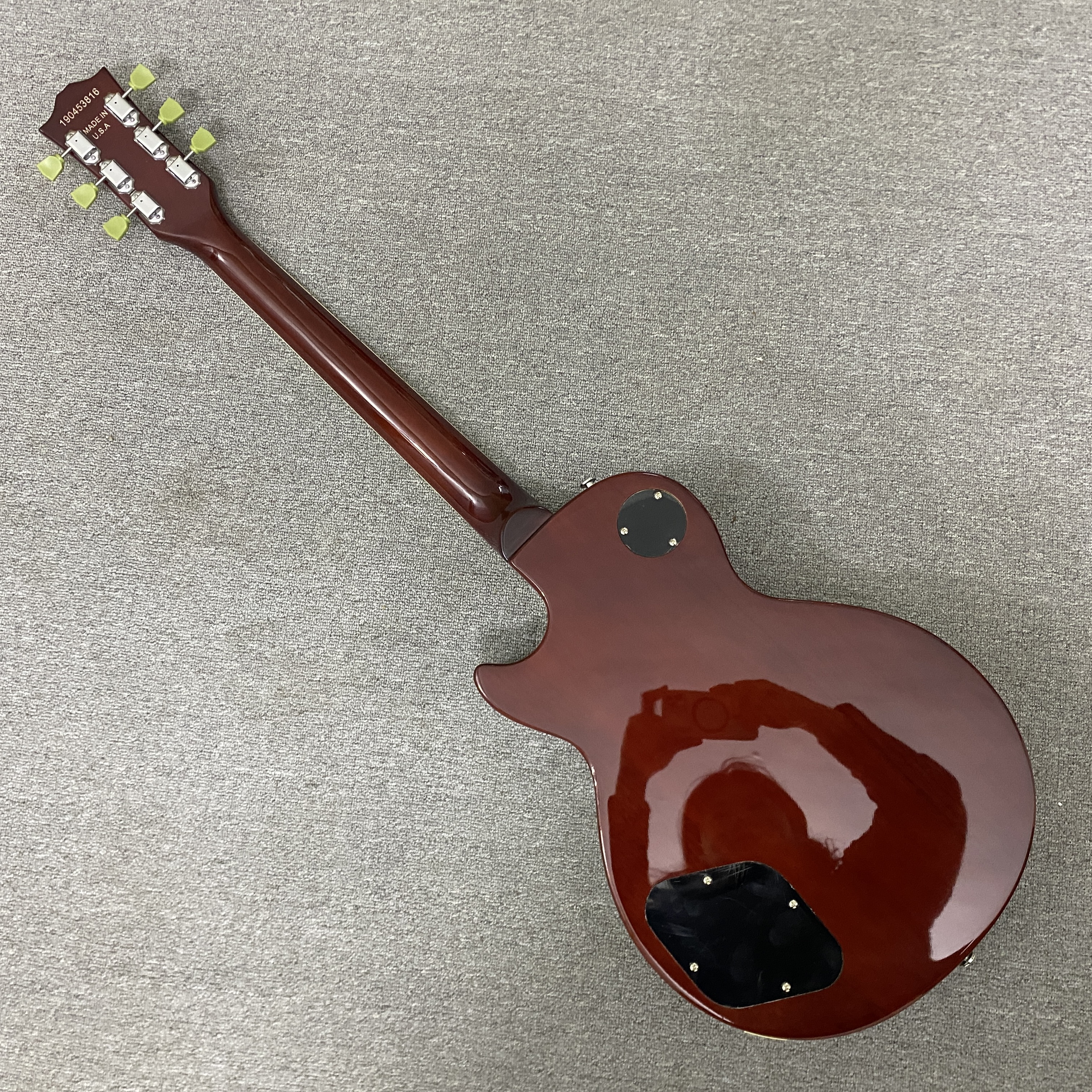 High-quality 6-string electric guitar with flame wood veneer, solid body, chrome hardware, HH pickups, mahogany body. Free shipping.