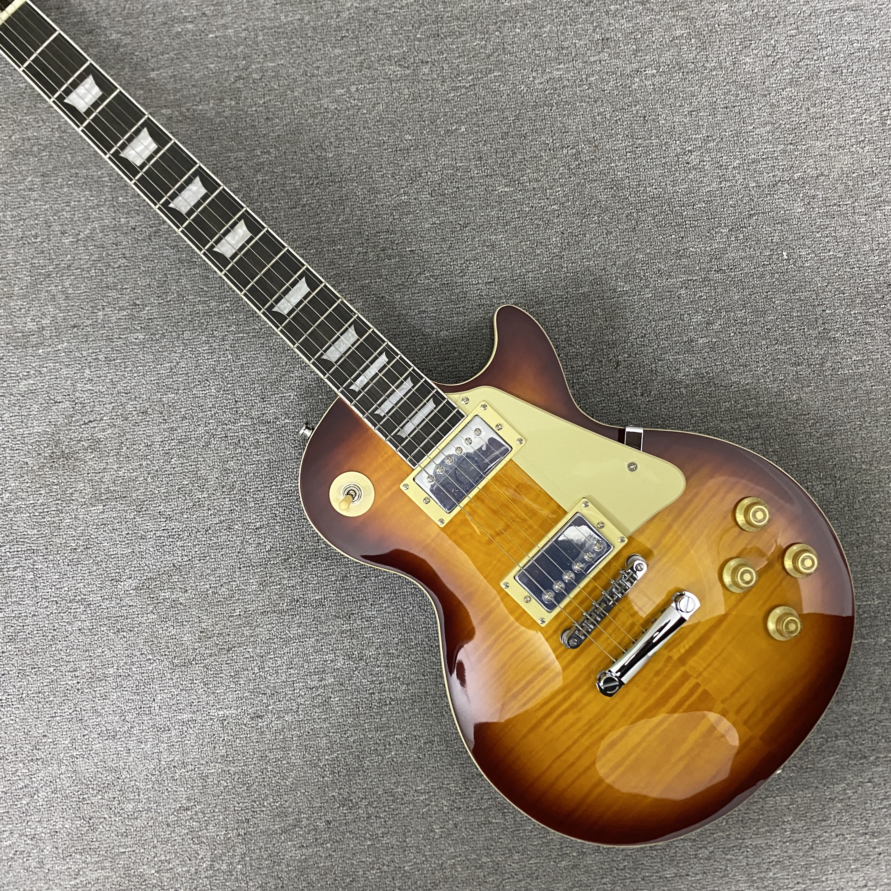 High-quality 6-string electric guitar with flame wood veneer, solid body, chrome hardware, HH pickups, mahogany body. Free shipping.