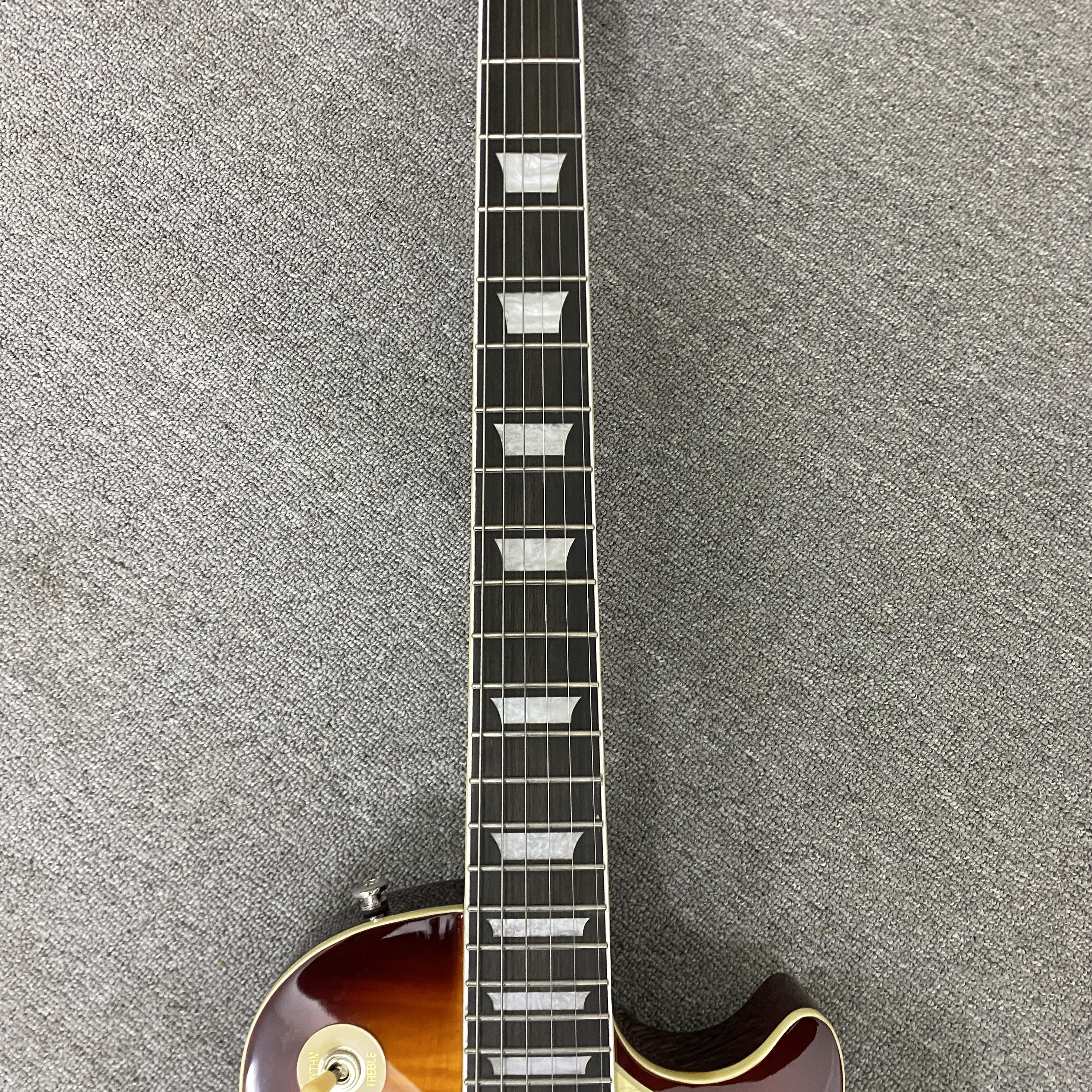 High-quality 6-string electric guitar with flame wood veneer, solid body, chrome hardware, HH pickups, mahogany body. Free shipping.