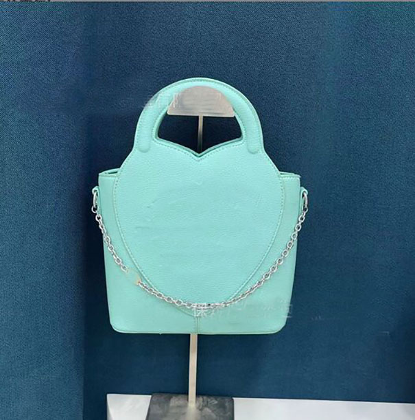 cowhide bag bucket bag women one shoulder crossbody bag designer handbag Litchi grain chain decoration tote luxury shopping bags leather bags purses backpack