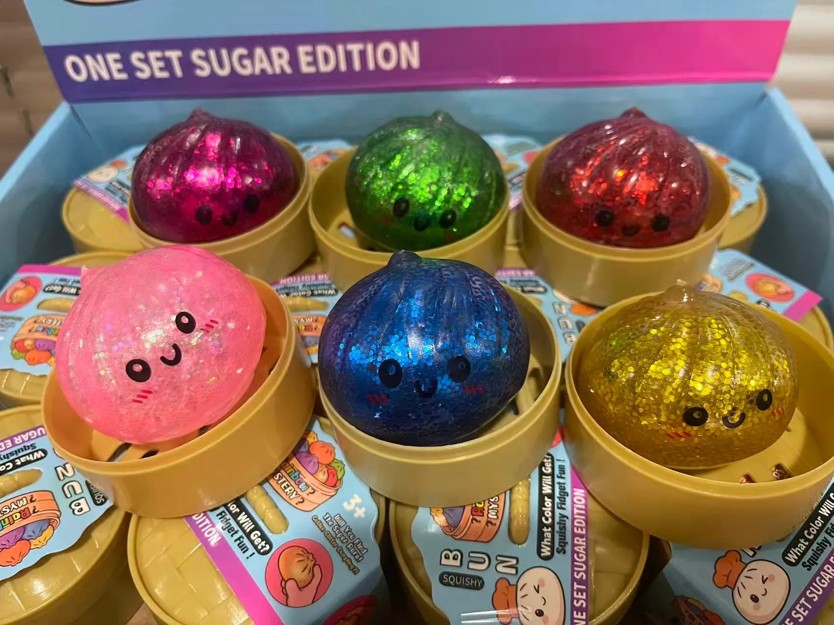 5.5CM Glitter Dumpling hape with Face Squishy Toy