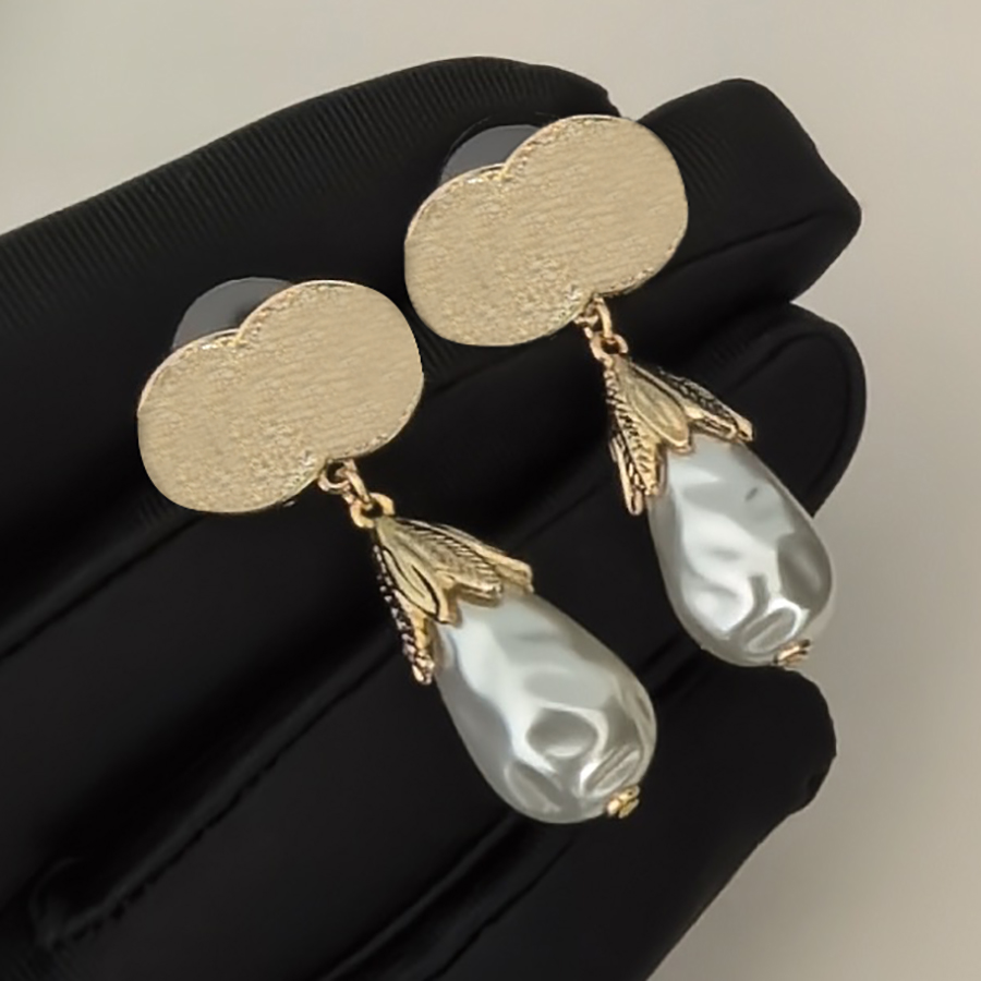 Light golden baroque pearl earrings Button