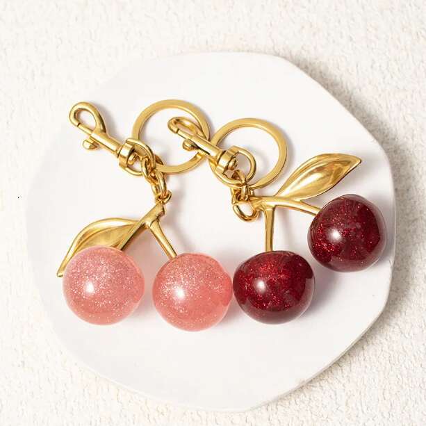 Golden Cherry Keychain Charm - Shiny Resin Metal Bag Accessory Elegant Gift for Women Purse or Handbag Decoration