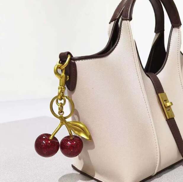 Golden Cherry Keychain Charm - Shiny Resin Metal Bag Accessory Elegant Gift for Women Purse or Handbag Decoration