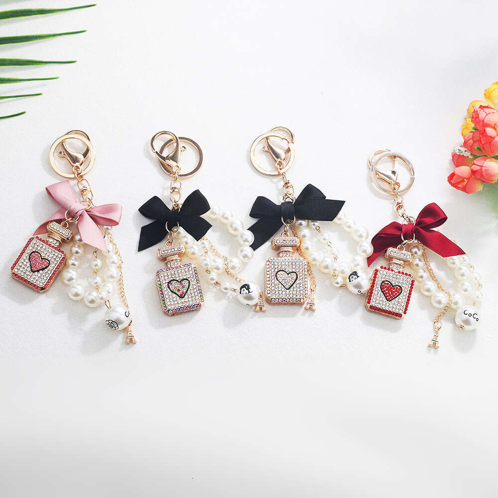 Korean Version Creative Fashion Inlaid with Diamonds Perfume Bottle Keychain Bowknot Pearl Bag Pendant Gift