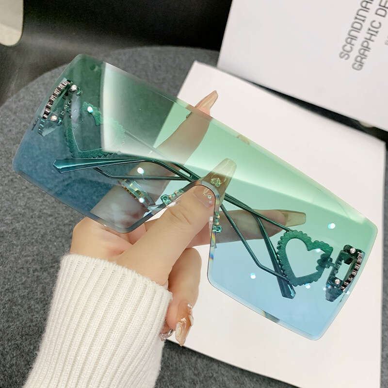 2024 new fashion onepiece heartshaped rimless european and american y2k internet celebrity style trendy sunglasses crossborder