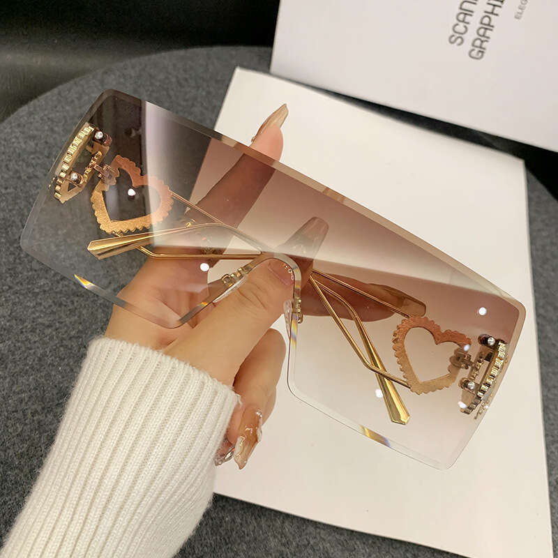 2024 new fashion onepiece heartshaped rimless european and american y2k internet celebrity style trendy sunglasses crossborder