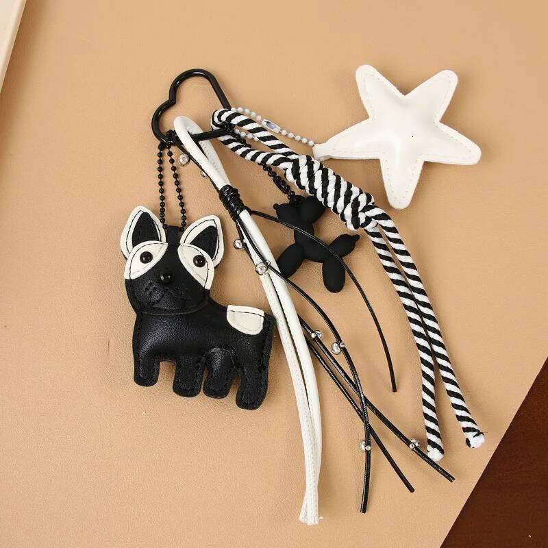 Designer women's black white wind cute magic doggie star leather bag niche creative versatile accessories pendant 26L0205