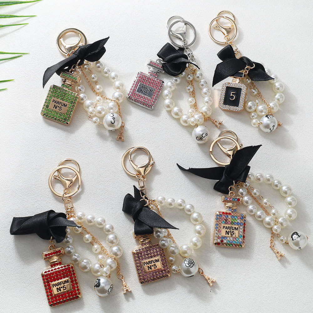 Korean Version Creative Fashion Inlaid with Diamonds Perfume Bottle Keychain Bowknot Pearl Bag Pendant Gift