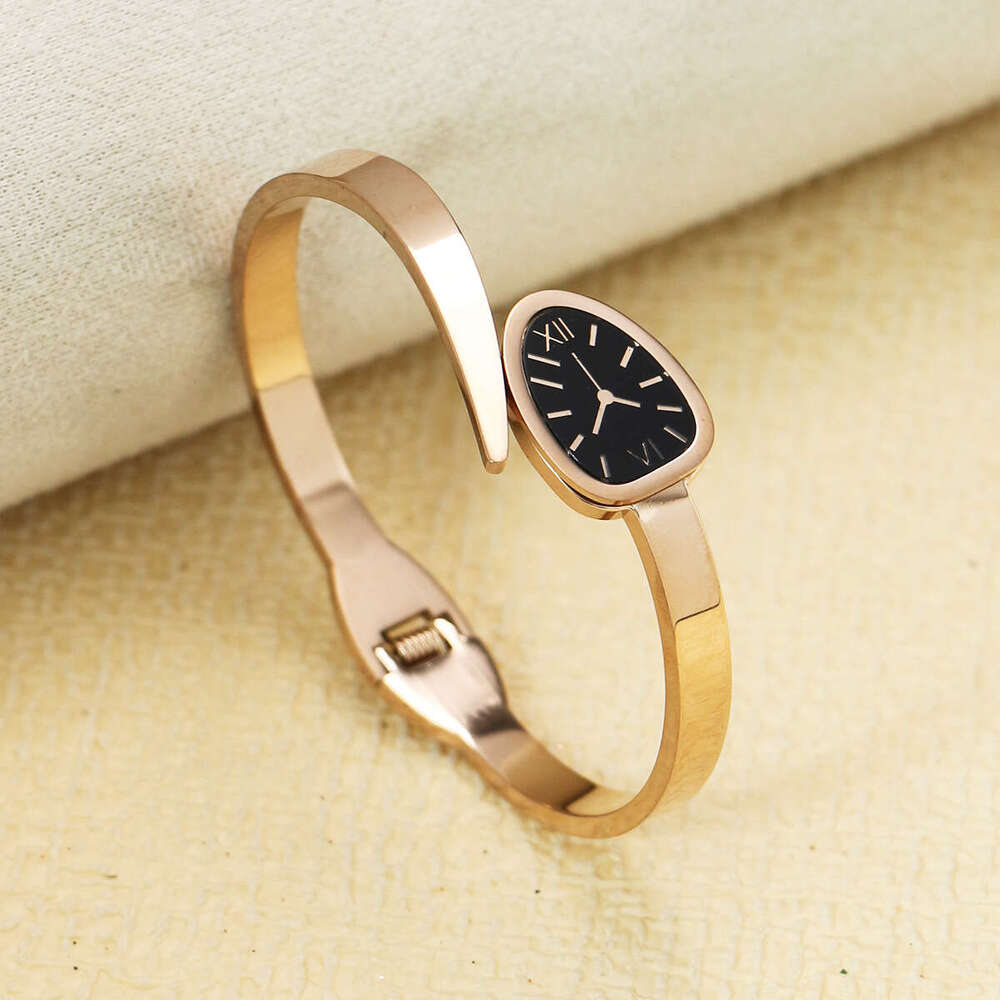 Vintage Watch-style Snake-shaped Quartz Oval Dial Band Roman Numerals Hollow Titanium Steel Bracelet