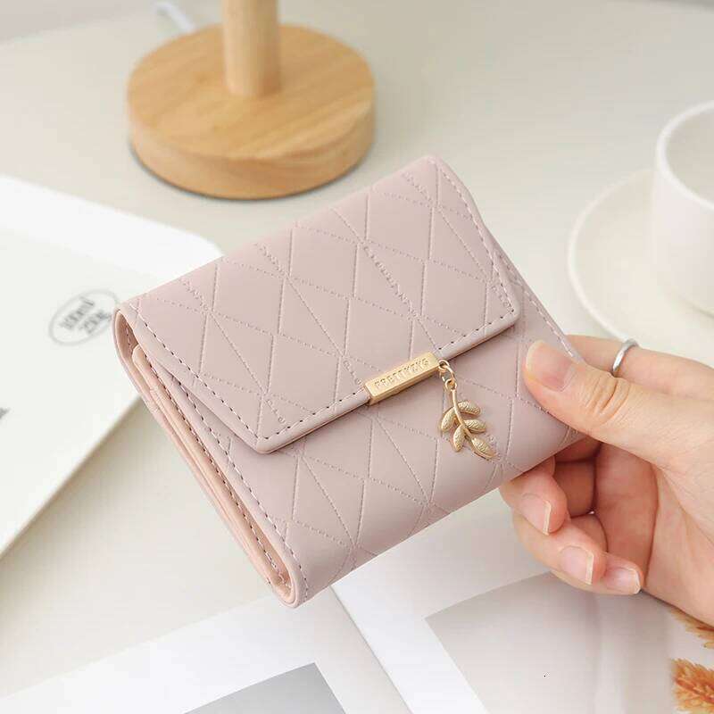 Autumn winter new women's short wallet Japan and South Korea small fresh PU simple folding hardware leaf pendant three fold Z260205