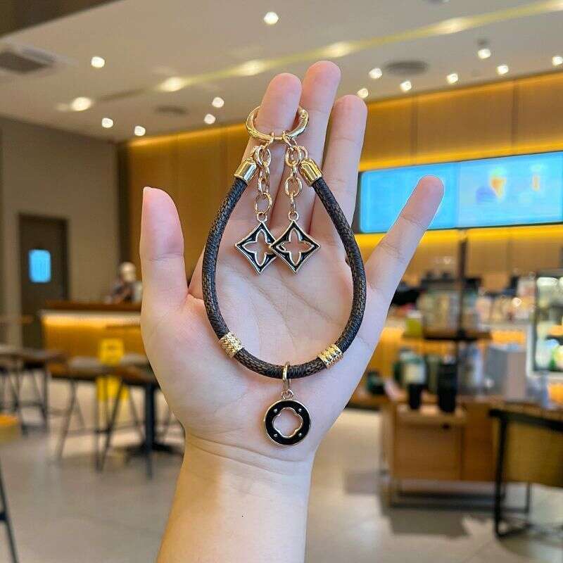 New High-End Sense Presbyopic Leather Light Luxury Gold Fashion Personality Temperament Mobile Phone Pendant Chain Car Keychain