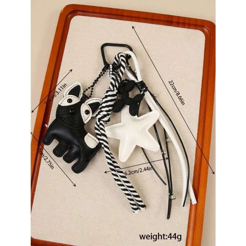 Designer women's black white wind cute magic doggie star leather bag niche creative versatile accessories pendant 26L0205