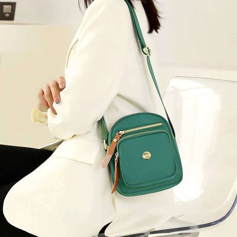 Neutral style compact mini bags men women, designed for travel and outings, featuring a simple single-shoulder design. XJ260129