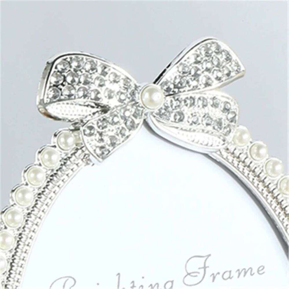 A bow shaped pearl studded diamond frame with a 3/6/7 inch oval photo frame, suitable for children's adult gifts, birthday parti S260205