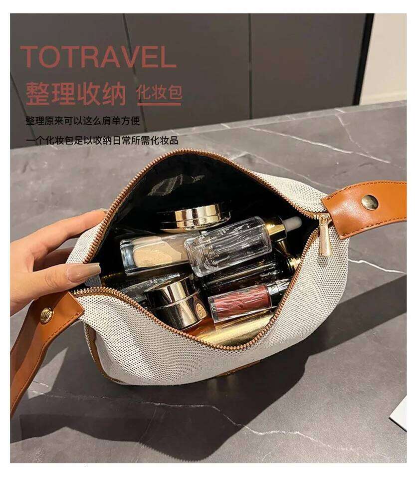 Double-layer metal label cosmetic bag, retro canvas portable hand-held bag with a high-end feel for storage Y260206