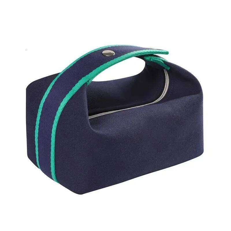 Simple and portable hand-held canvas personalized unisex makeup large capacity waterproof storage bag, toiletry bag. Y260206