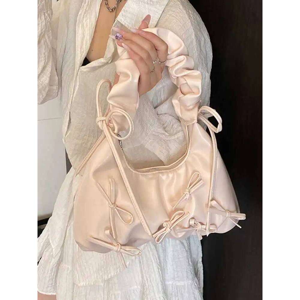 Korean Design Sense Single Shoulder Bags Spring Summer 2025 New Women's Bow Decoration Armpit Bag Niche Commuting Pleated Pack Y260205