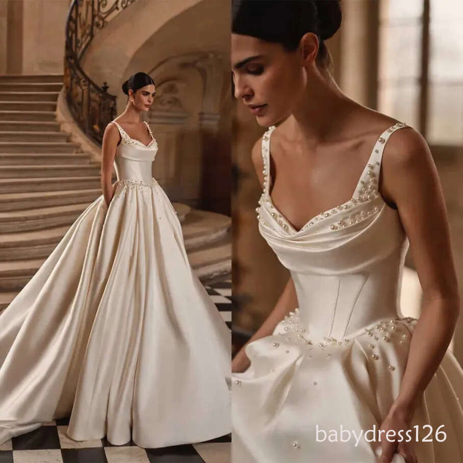 2026 New Charming A Line Wedding Dresses Pearls Beading Satin Spaghetti Straps Bridal Gowns Backless Pleats Bride Dress F04