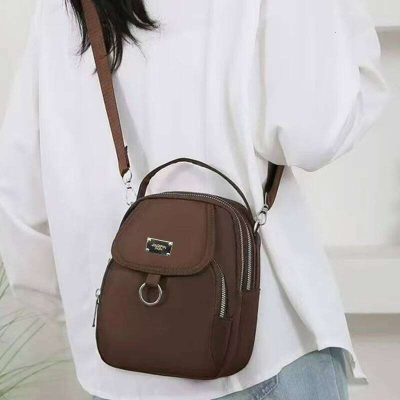 Neutral style backpack men women, suitable for travel and photography, multi-layered pocket, cross-body bag XJ260129