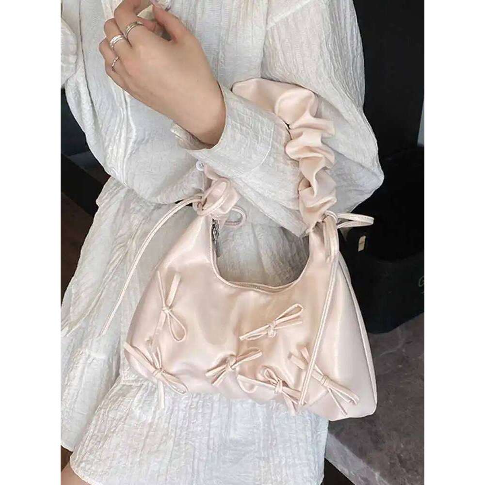 Korean Design Sense Single Shoulder Bags Spring Summer 2025 New Women's Bow Decoration Armpit Bag Niche Commuting Pleated Pack Y260205