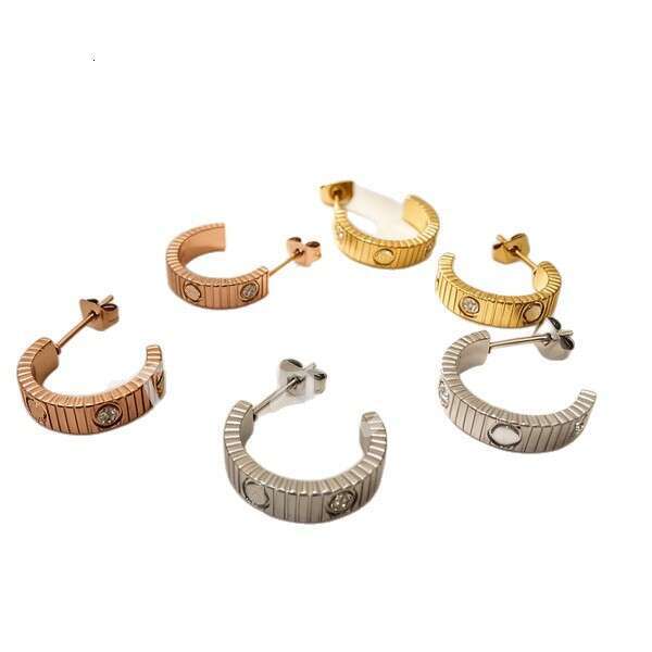 Kaga's new strap series vacuum-plated titanium steel striped classic screw stud earrings, wholesale for foreign trade