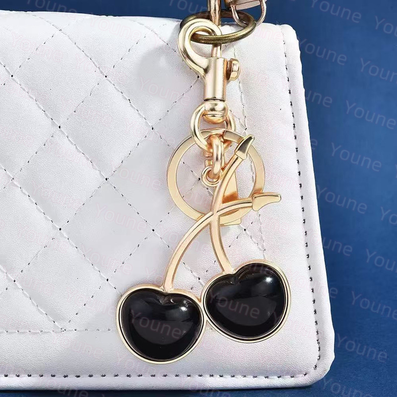 Luxury Keychains Exquisite Cherry Keychain Pendant Versatile Designer Bag Charm Antique Small Pretzel Tabby Bag For Women's Accessories Dropship co ch topia
