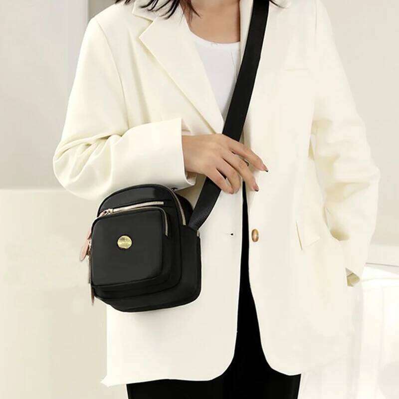 Neutral style compact mini bags men women, designed for travel and outings, featuring a simple single-shoulder design. XJ260129