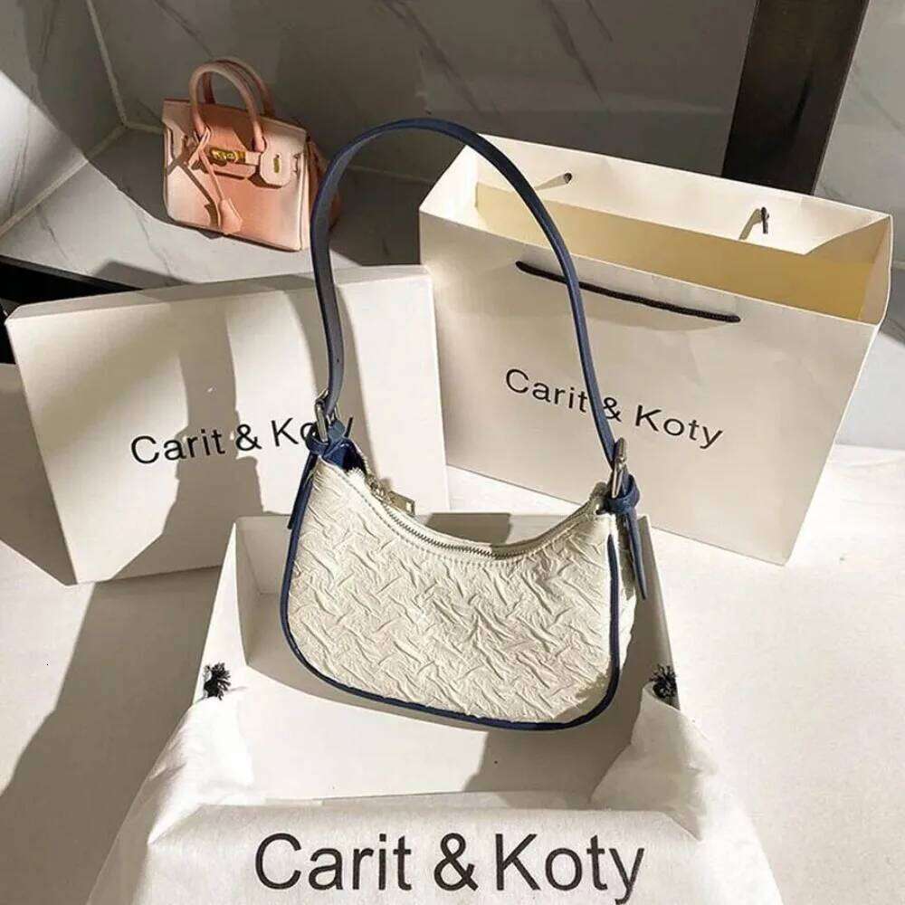 Original advanced sense this year's popular pleated female summer niche design crescent underarm bag shoulder Y260205