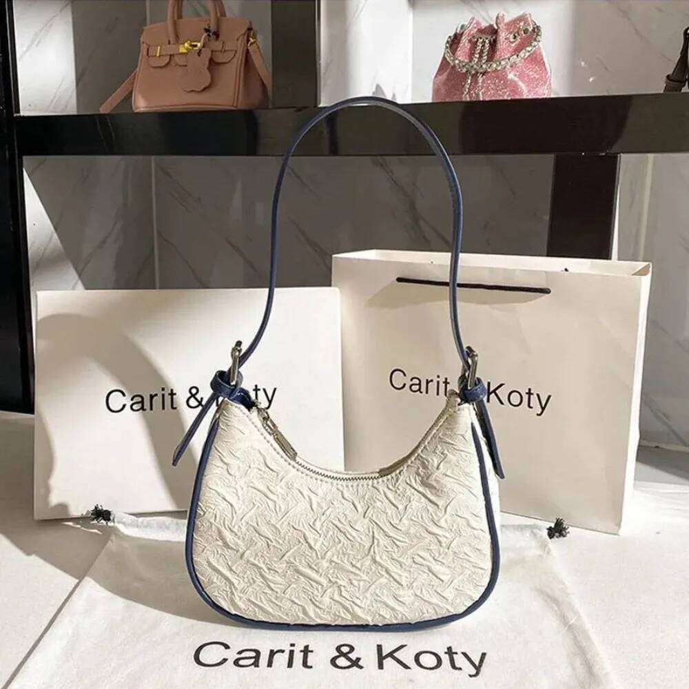 Original advanced sense this year's popular pleated female summer niche design crescent underarm bag shoulder Y260205