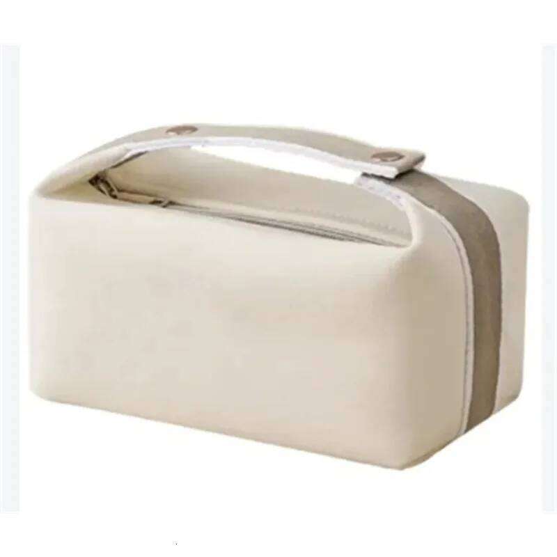 Simple and portable hand-held canvas personalized unisex makeup large capacity waterproof storage bag, toiletry bag. Y260206