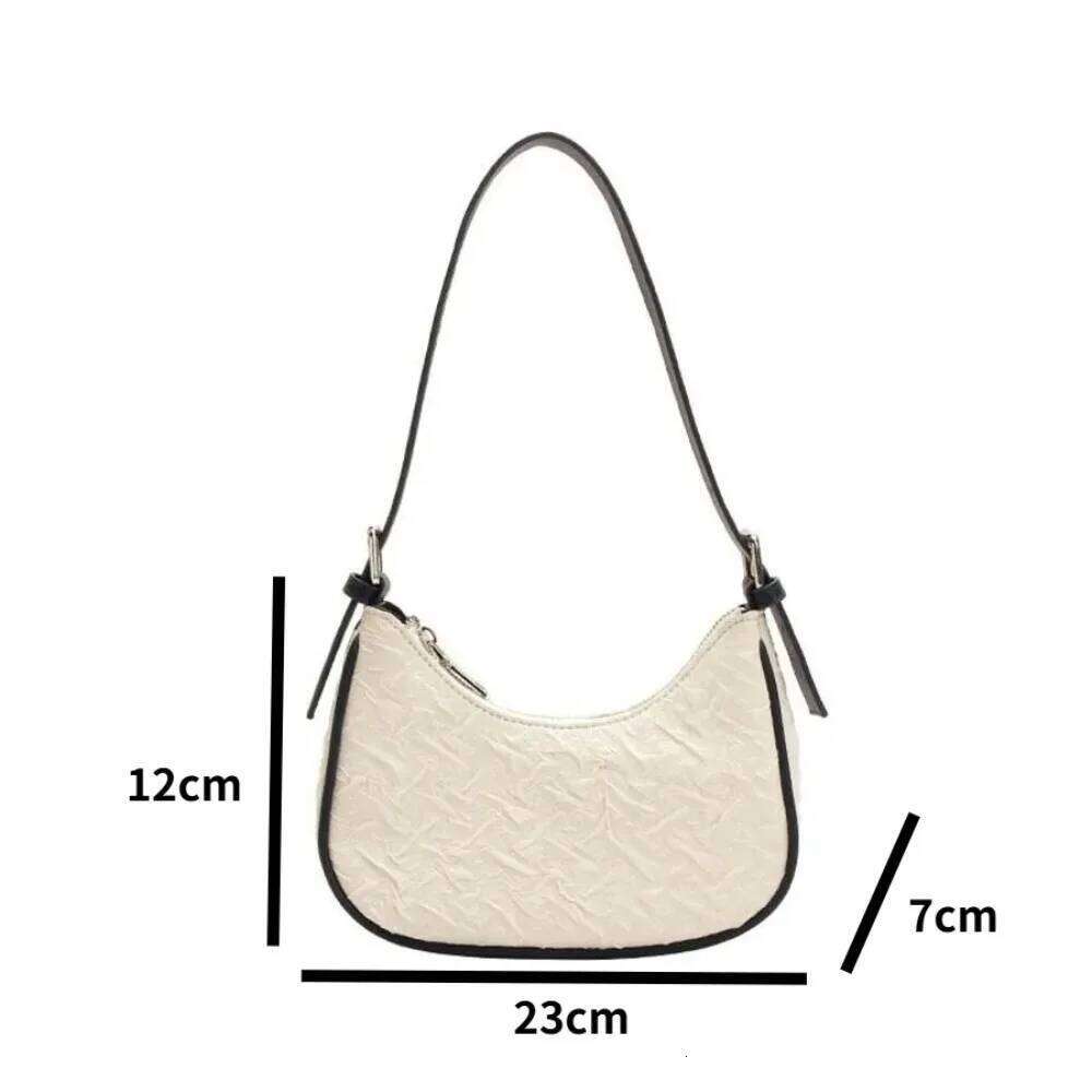 Original advanced sense this year's popular pleated female summer niche design crescent underarm bag shoulder Y260205