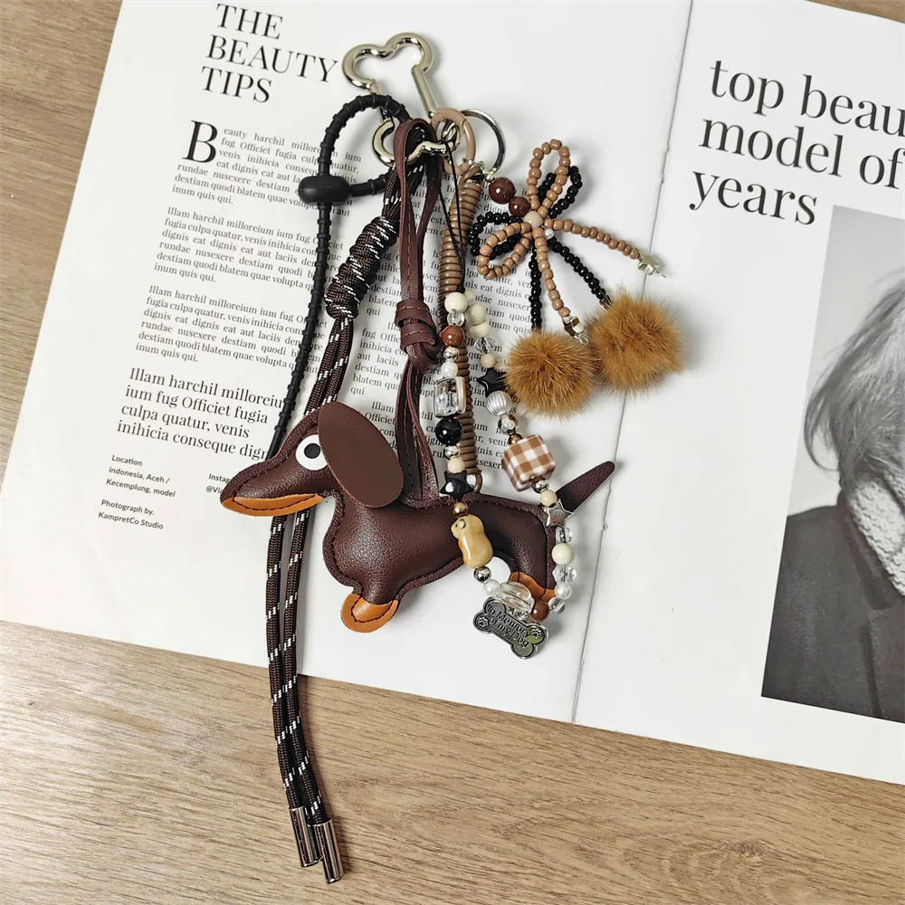 Handmade baseball personality keychain Creative simple soda bread fringe trend accessories Dachshund dog bow hairball bag pendan 260107