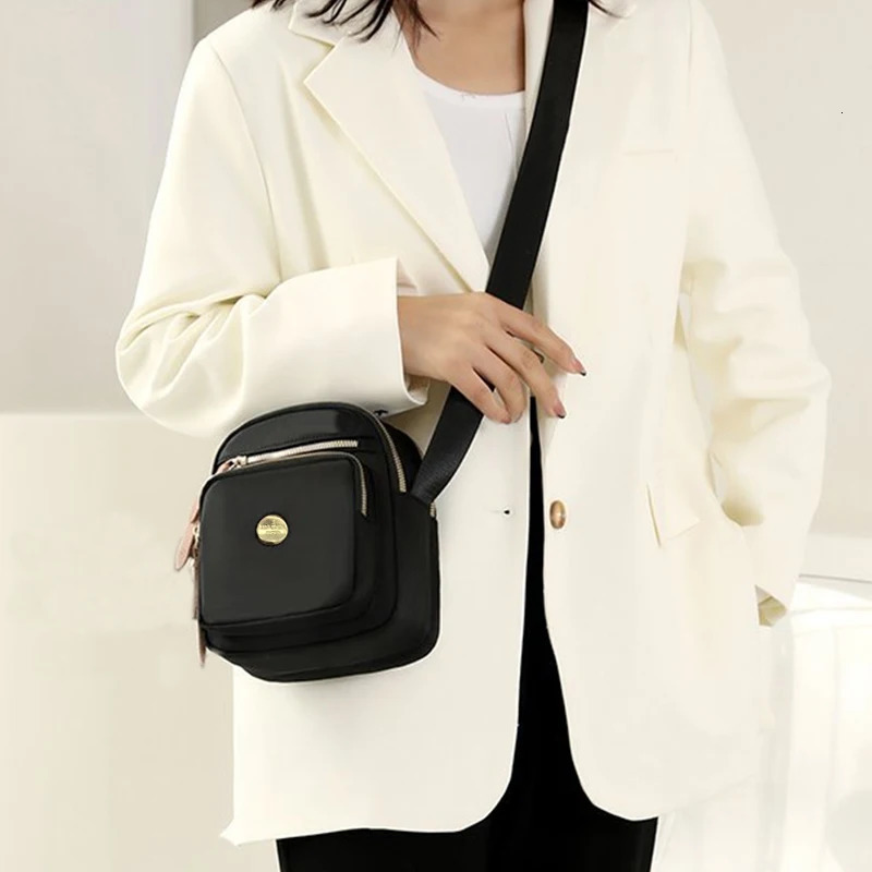 Neutral style compact mini bags for men and women ned travel outings featuring a simple singleshoulder n 260208