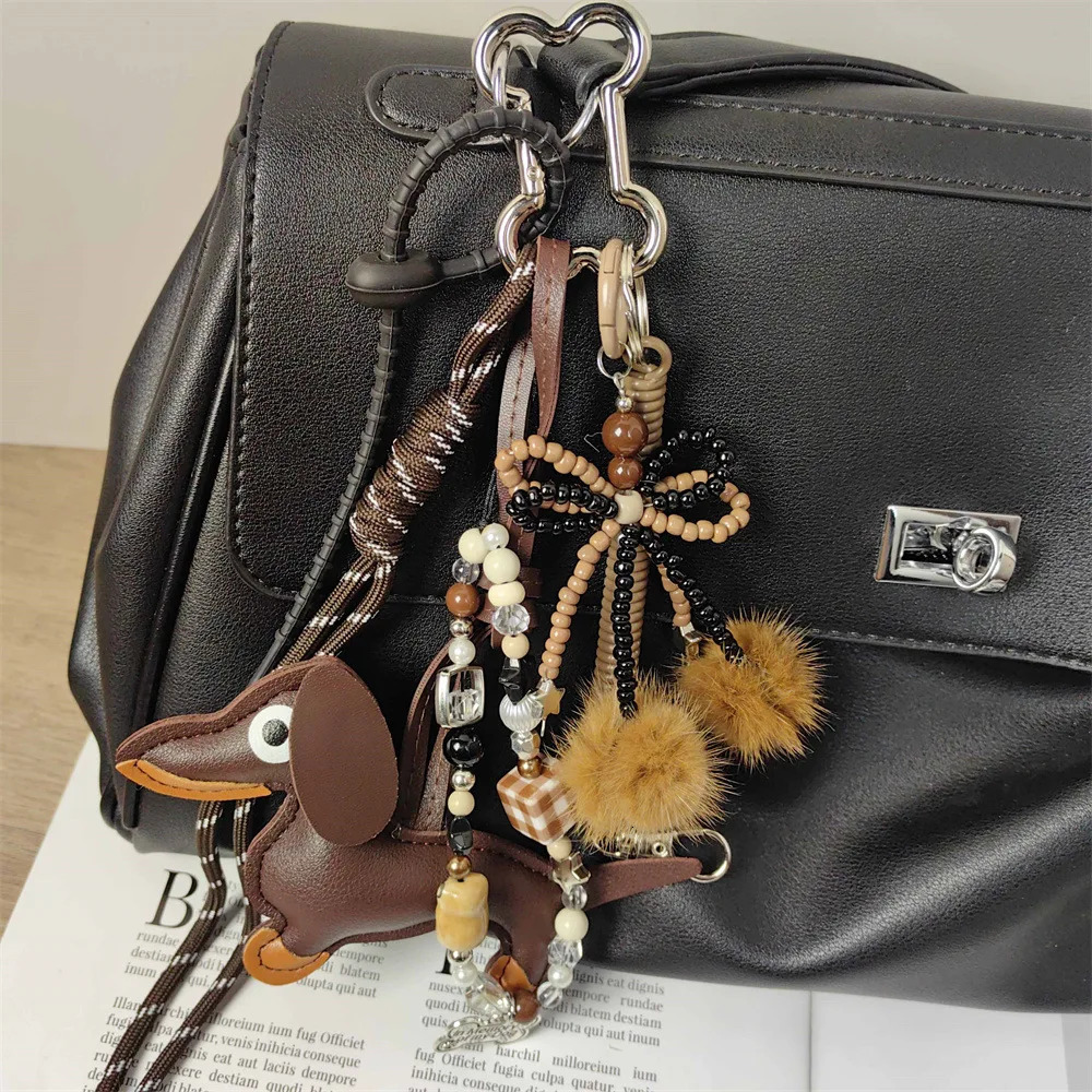 Handmade baseball personality keychain Creative simple soda bread fringe trend accessories Dachshund dog bow hairball bag pendan 260107