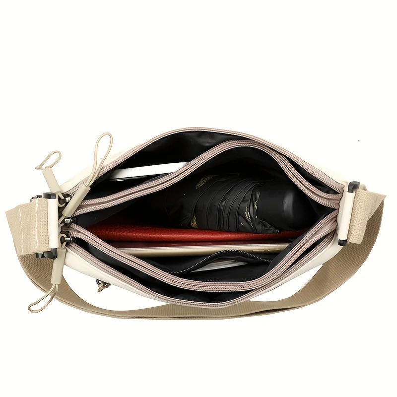 This largecapacity crossbody bag for women features a multizipper n and adjustable shoulder straps making it suitable fo 260208