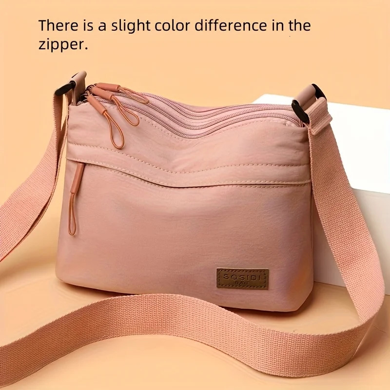 This largecapacity crossbody bag for women features a multizipper n and adjustable shoulder straps making it suitable fo 260208