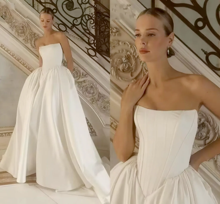 2026 Designer Minimalist Ivory Satin Wedding Dress Drop Basque Waist Puffy Skirt Boho Bridal Gowns Sexy Strapless Sweep Train Bride Ceremony Robe De M