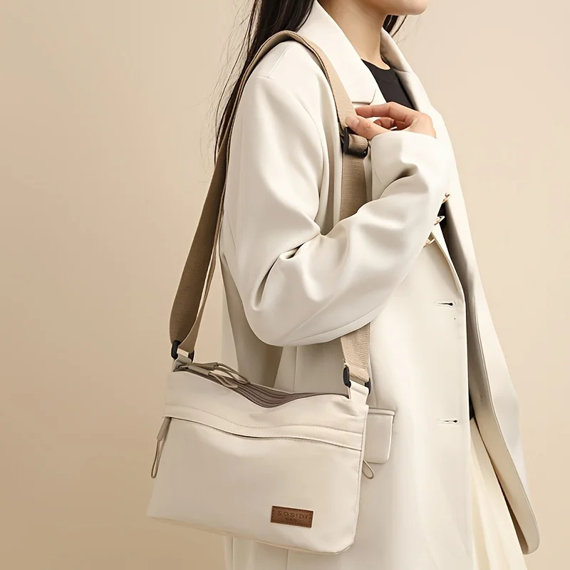 This largecapacity crossbody bag for women features a multizipper n and adjustable shoulder straps making it suitable fo 260208