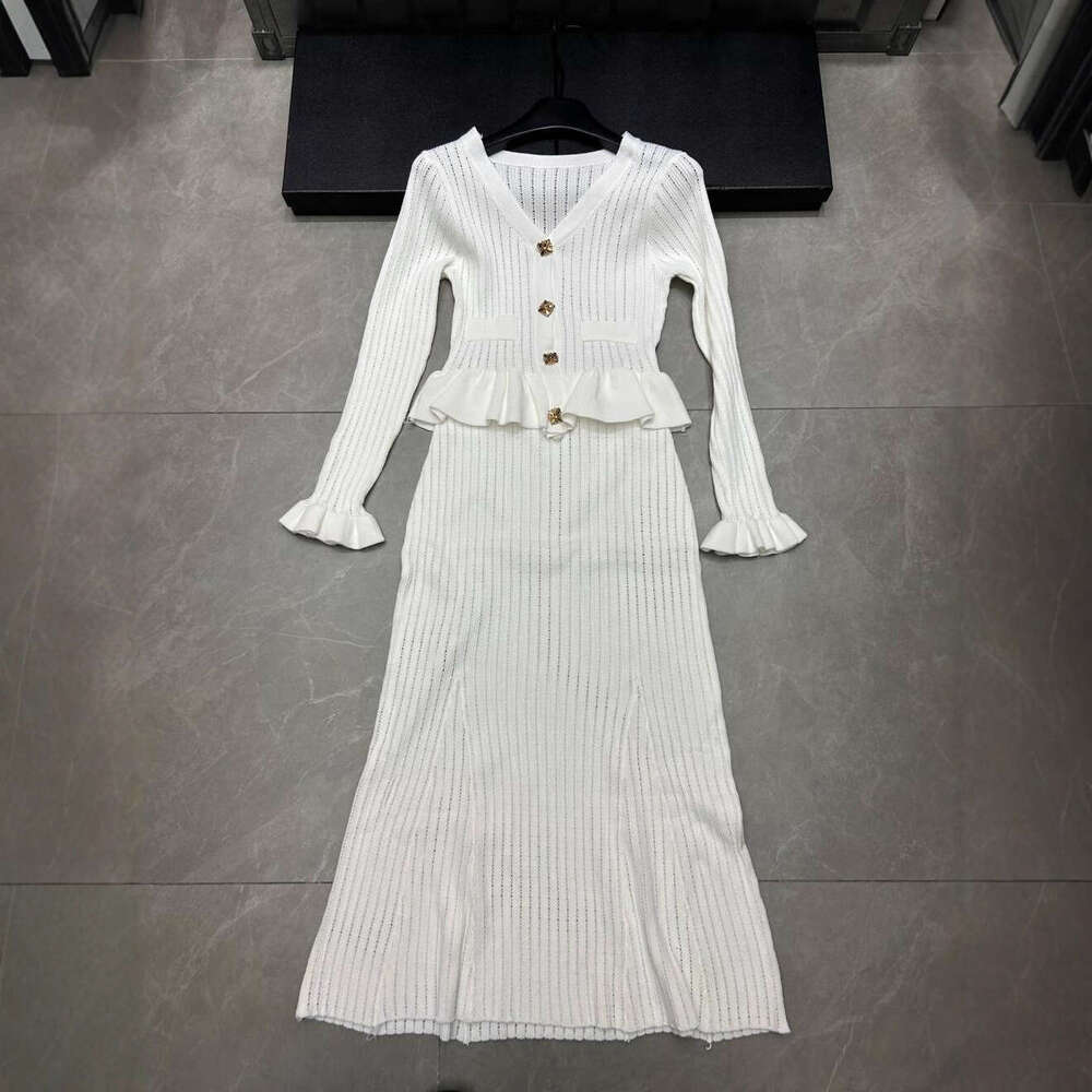 2026 autumn and winter new hollow knitted long sleeved single breasted cardigan loose multi-functional two-piece skirt for women