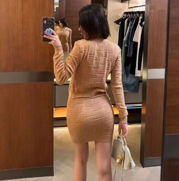 Designer style metal buckle hollow knit women's cardigan 2026 autumn new slim fit high-end jacket