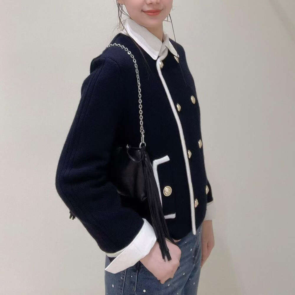 High end women's clothing 2026 autumn and winter new item daily commuting leisure versatile double breasted simple soft knitted sweater