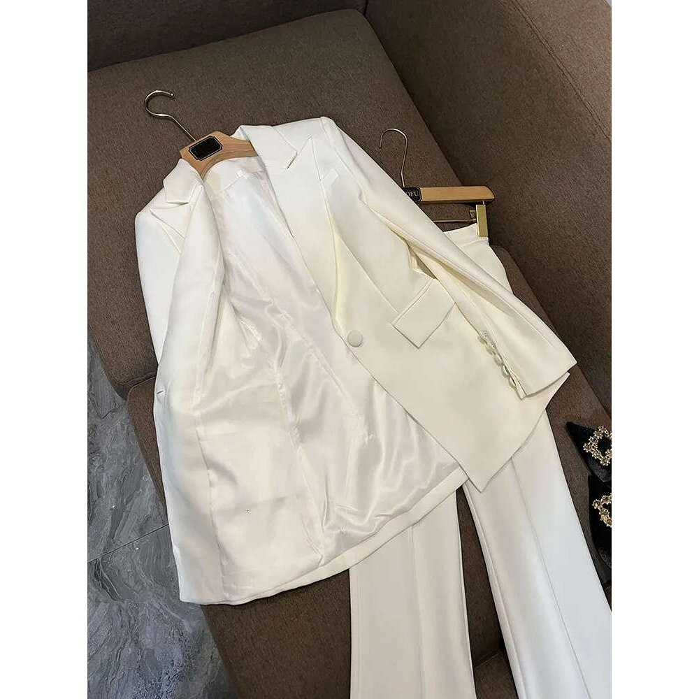 Autumn white and black solid color two-piece long sleeved split single button sports jacket top high waisted flared pants long pants set