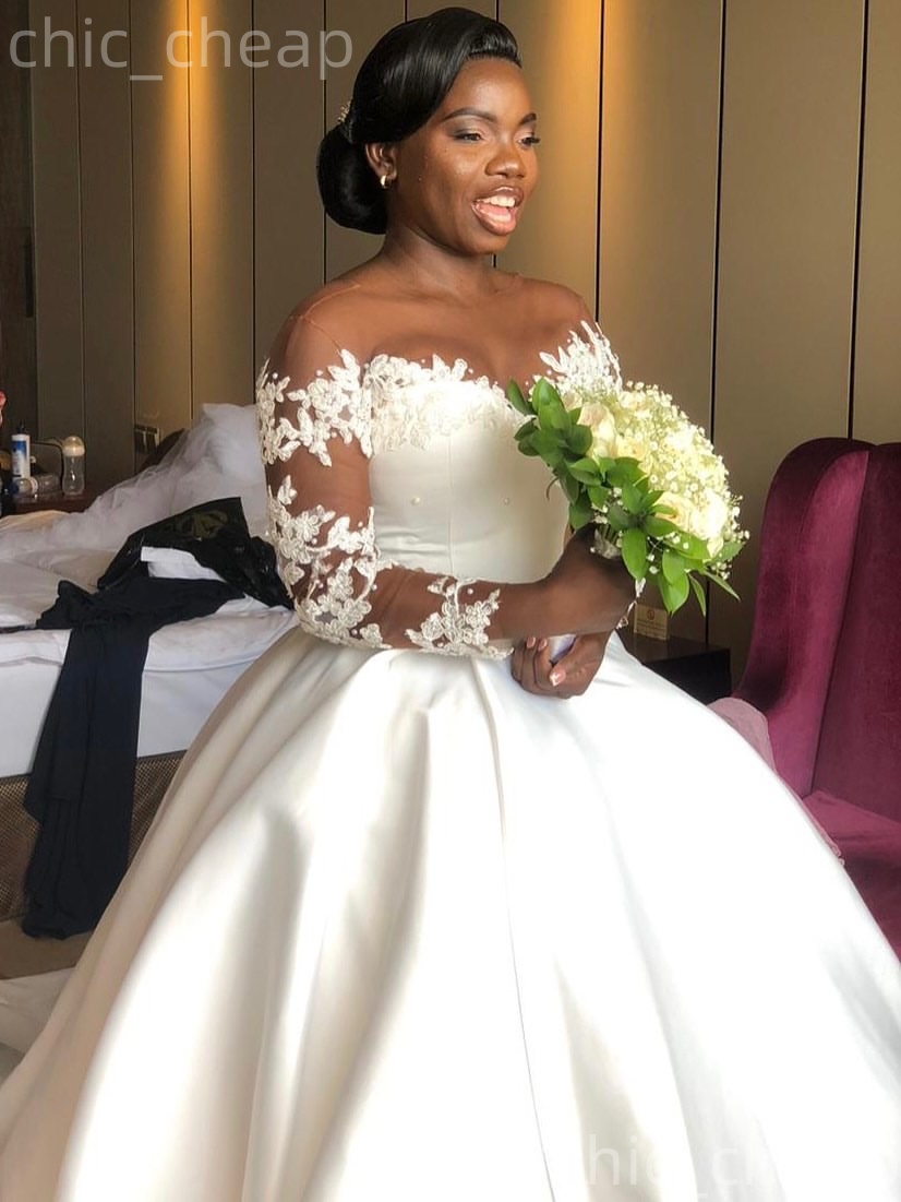 African Aso Ebi 2026 Ivory Ball Gown Wedding Dress Appliques Pearls Sheer Neck Full Sleeves Satin Elegant Bridal Gowns Dresses ZJ2334