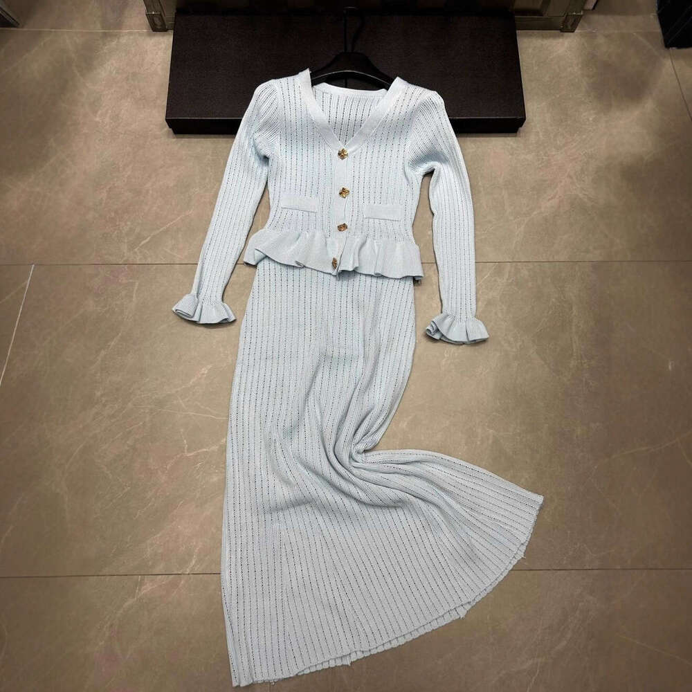 2026 autumn and winter new hollow knitted long sleeved single breasted cardigan loose multi-functional two-piece skirt for women