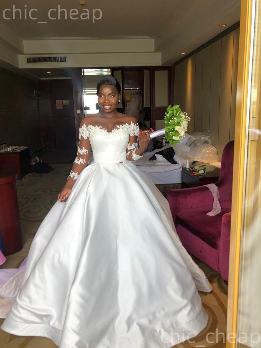 African Aso Ebi 2026 Ivory Ball Gown Wedding Dress Appliques Pearls Sheer Neck Full Sleeves Satin Elegant Bridal Gowns Dresses ZJ2334