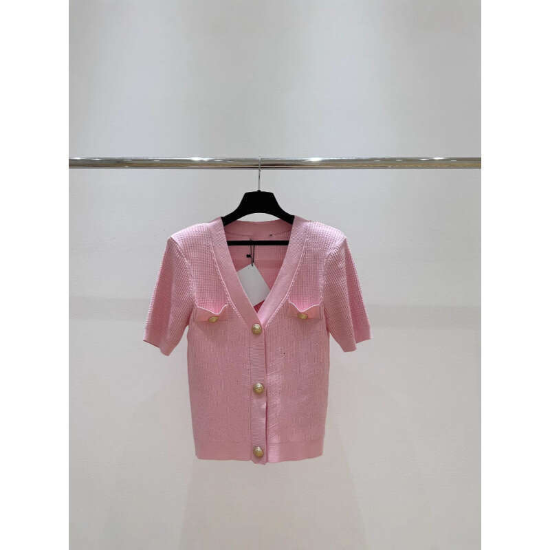 2026 New Designer's Top 100 Round Neck Pattern Knitted Long Sleeve Top with Metal Buckle Skirt